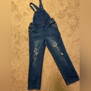 Overalls with holes and patches